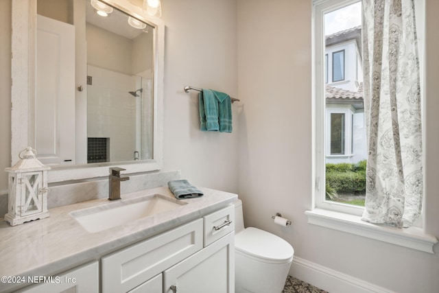5275 Bentpine Cove Rd, Jacksonville, FL 32224 - bathroom with plenty of natural light, toilet, tiled shower, and vanity