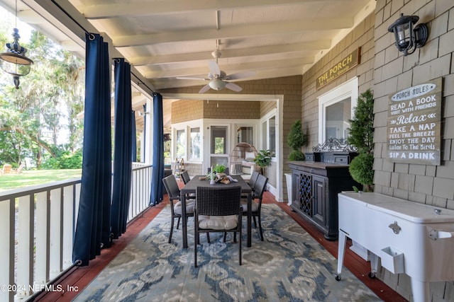 sunroom / solarium with lofted ceiling with beams and ceiling fan