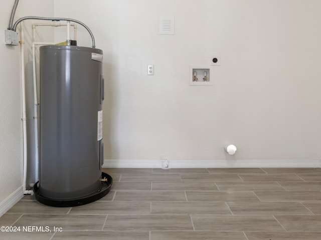 utility room with electric water heater