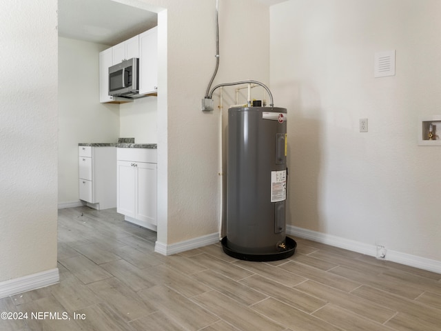 utility room featuring electric water heater