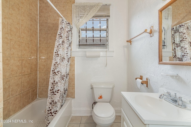 full bathroom featuring tile flooring, shower / tub combo, large vanity, and toilet