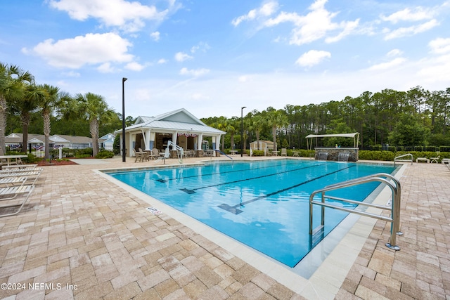 view of swimming pool with a patio