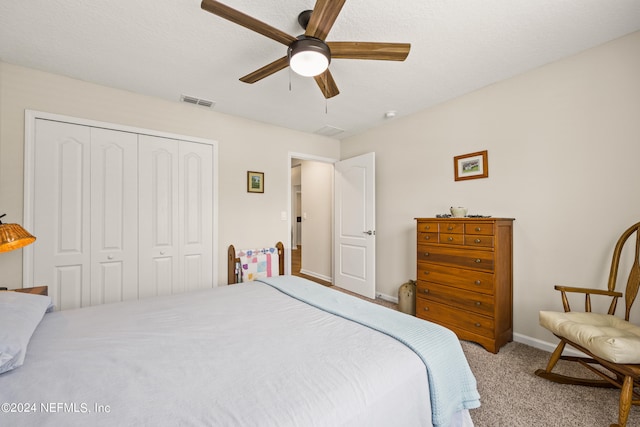 bedroom featuring a closet, ceiling fan, and carpet floors