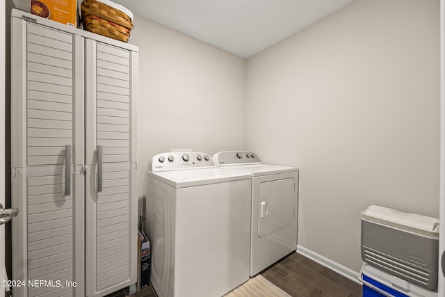 washroom with separate washer and dryer and hardwood / wood-style flooring