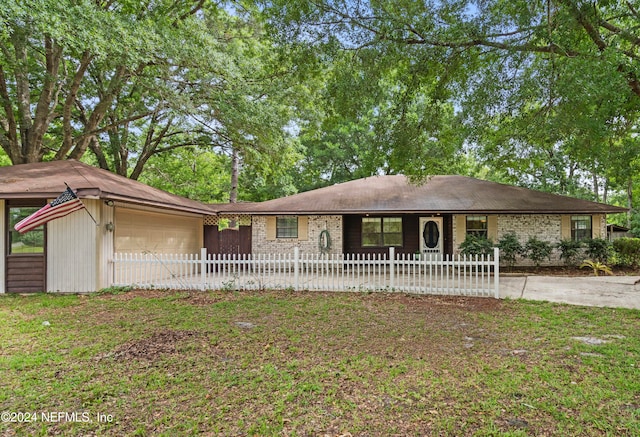 ranch-style home featuring a garage