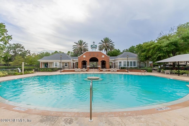 view of swimming pool featuring a patio area