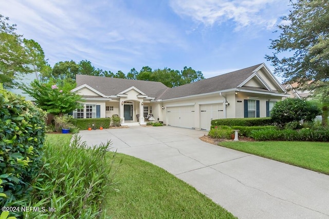 view of front facade with a front lawn and a garage