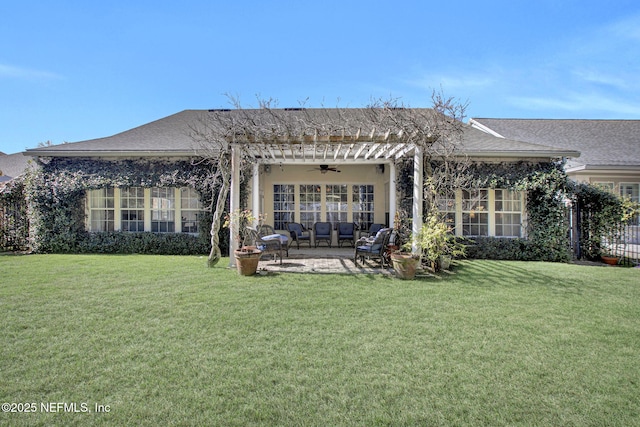 rear view of house with a patio, a pergola, a lawn, and ceiling fan