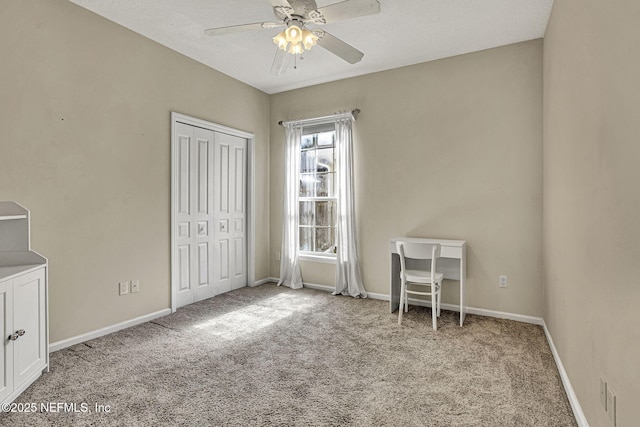 unfurnished bedroom featuring light carpet, ceiling fan, and a closet