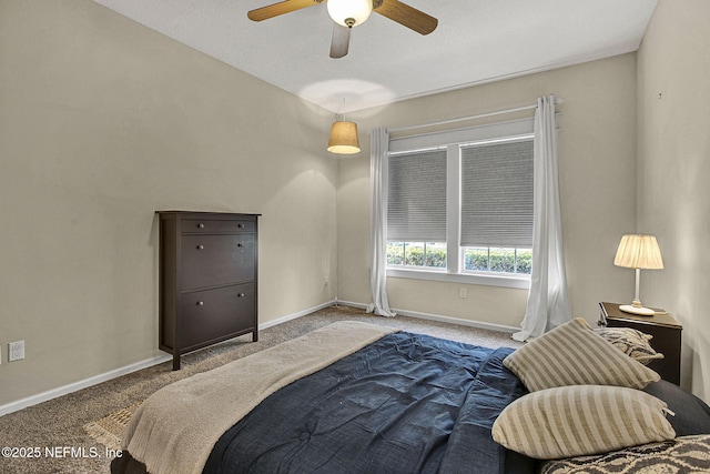 bedroom featuring ceiling fan and carpet flooring