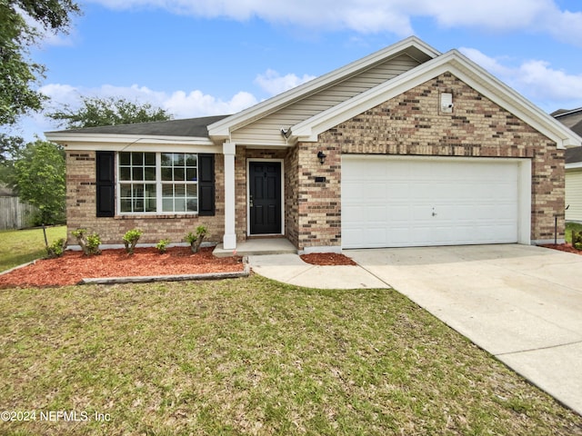 view of front facade featuring a front yard and a garage