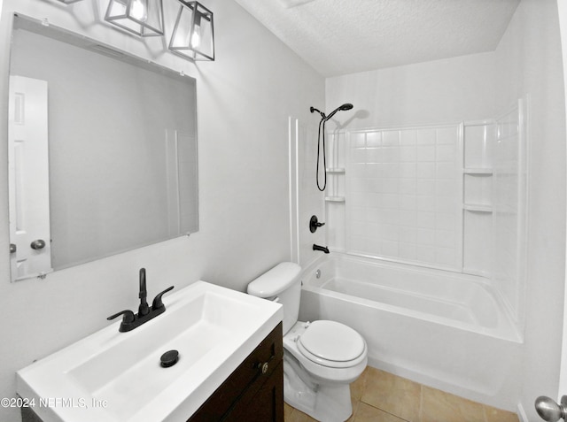 full bathroom with tile flooring, washtub / shower combination, a textured ceiling, toilet, and vanity