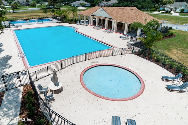 view of swimming pool featuring a patio area