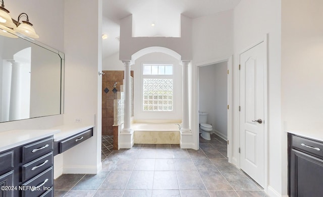 full bathroom with vanity, tile patterned floors, separate shower and tub, toilet, and ornate columns