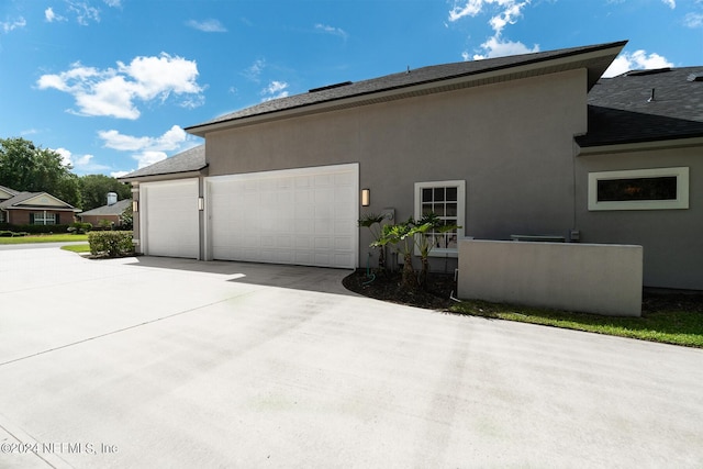 view of side of property featuring a garage