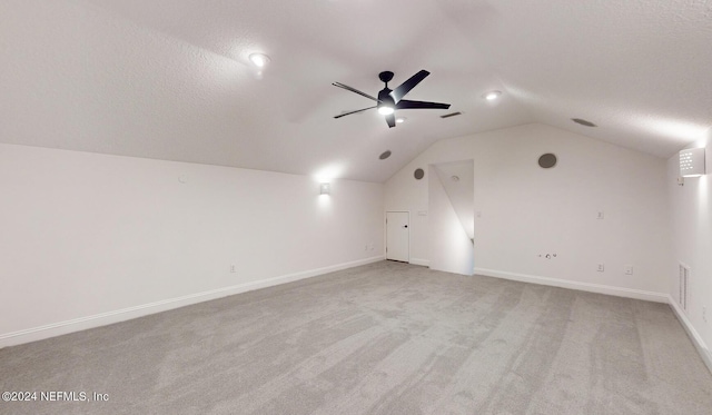 bonus room featuring light carpet, ceiling fan, and vaulted ceiling