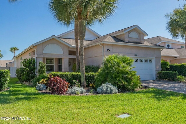 ranch-style home featuring a front yard