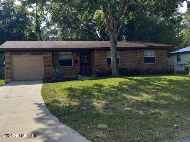 ranch-style house with a garage and a front yard