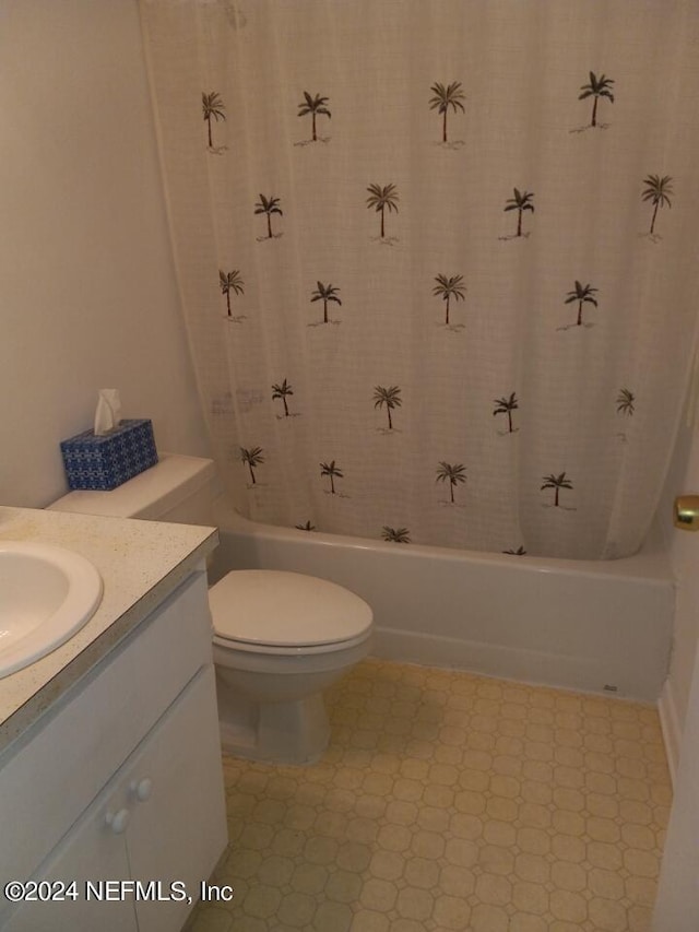 full bathroom featuring vanity, shower / tub combo, and toilet