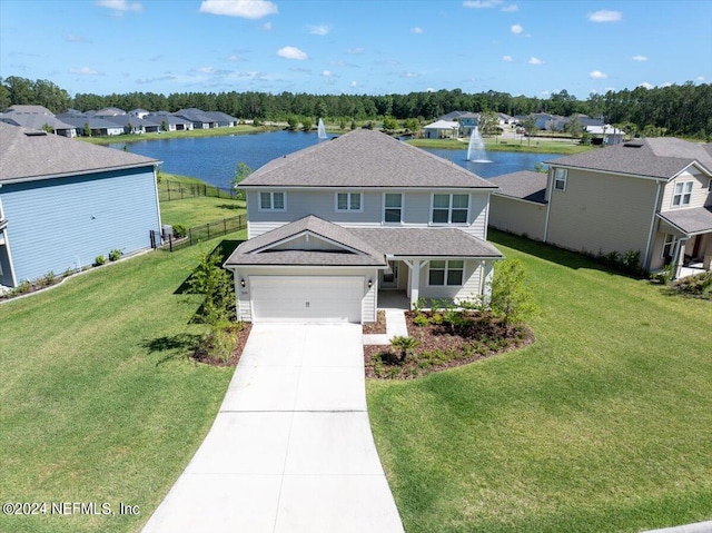 view of front of home featuring a garage, a water view, and a front yard