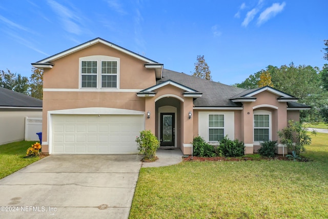 front facade featuring a garage and a front lawn