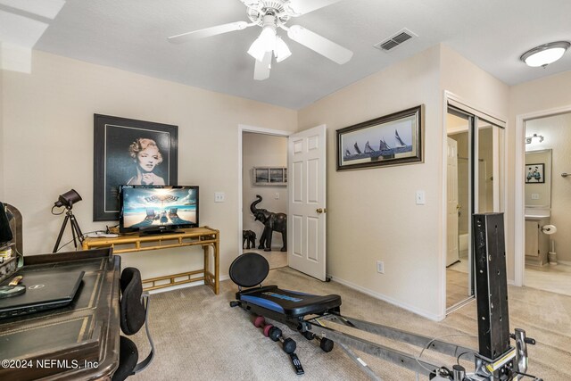1701 The Greens Way Unit 1224, Jacksonville Beach, FL 32250 - workout area featuring ceiling fan and light colored carpet