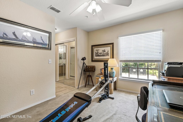 1701 The Greens Way Unit 1224, Jacksonville Beach, FL 32250 - exercise room with ceiling fan and light colored carpet