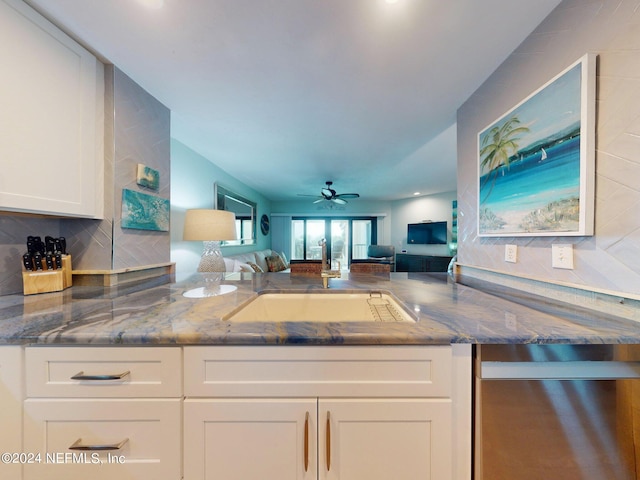 kitchen with ceiling fan, tasteful backsplash, white cabinetry, dishwasher, and stone countertops