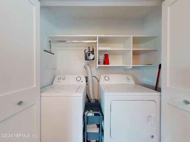 clothes washing area featuring washing machine and dryer