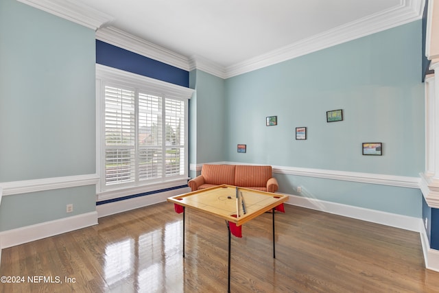 interior space with ornamental molding and dark hardwood / wood-style flooring