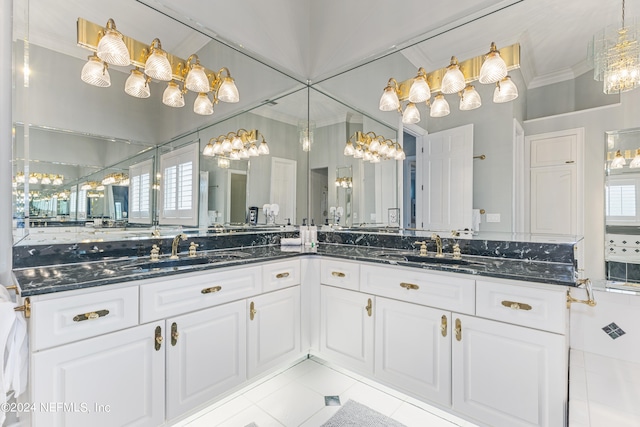 bathroom featuring tile floors, a wealth of natural light, ornamental molding, and oversized vanity