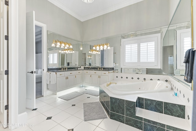 bathroom featuring a healthy amount of sunlight, tile flooring, vanity, and ornamental molding