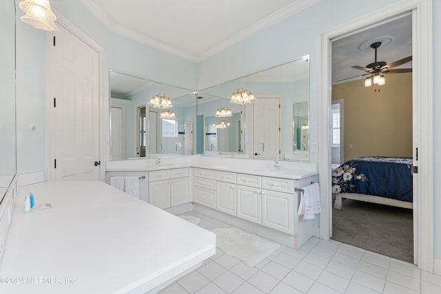 bathroom with crown molding, tile flooring, double sink vanity, and ceiling fan with notable chandelier