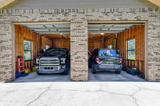 garage featuring wood walls