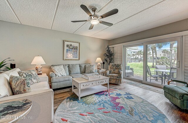 8550 A1A Unit 12122, Saint Augustine, FL 32080 - living room featuring hardwood / wood-style floors, ceiling fan, and a textured ceiling
