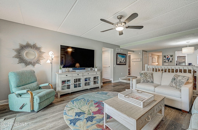 8550 A1A Unit 12122, Saint Augustine, FL 32080 - living room with wood-type flooring, ceiling fan, and a textured ceiling