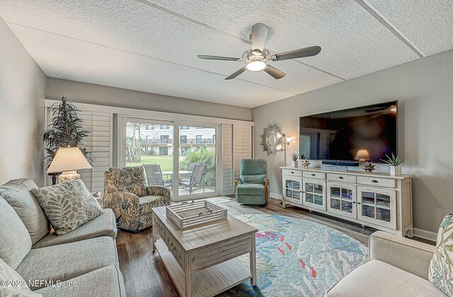 8550 A1A Unit 12122, Saint Augustine, FL 32080 - living room with dark hardwood / wood-style floors, ceiling fan, and a textured ceiling