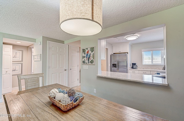 8550 A1A Unit 12122, Saint Augustine, FL 32080 - dining room featuring sink and a textured ceiling