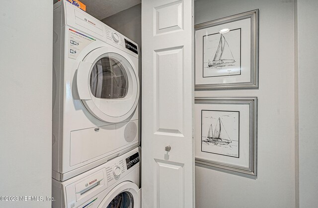 8550 A1A Unit 12122, Saint Augustine, FL 32080 - laundry area with stacked washer / drying machine
