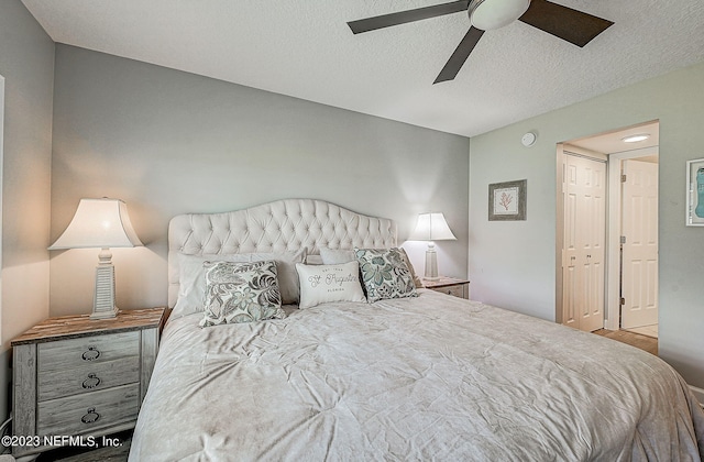 8550 A1A Unit 12122, Saint Augustine, FL 32080 - bedroom featuring ceiling fan, a closet, and a textured ceiling