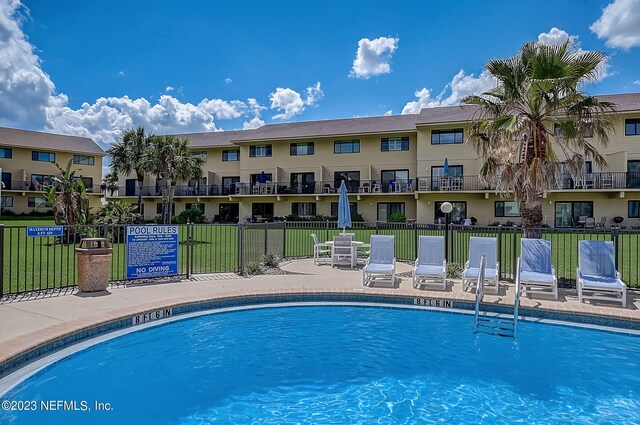 8550 A1A Unit 12122, Saint Augustine, FL 32080 - view of swimming pool featuring a yard