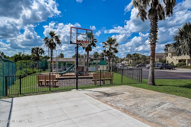 8550 A1A Unit 12122, Saint Augustine, FL 32080 - view of sport court with a playground and a lawn
