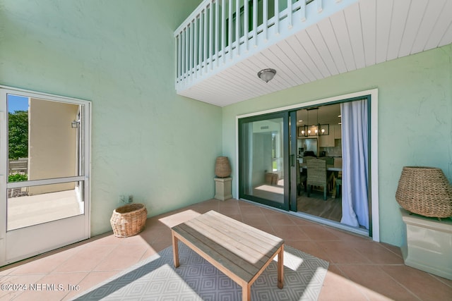 view of patio featuring a balcony