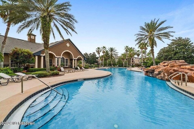 view of swimming pool featuring a patio