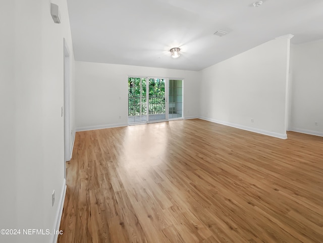 spare room featuring light wood-type flooring