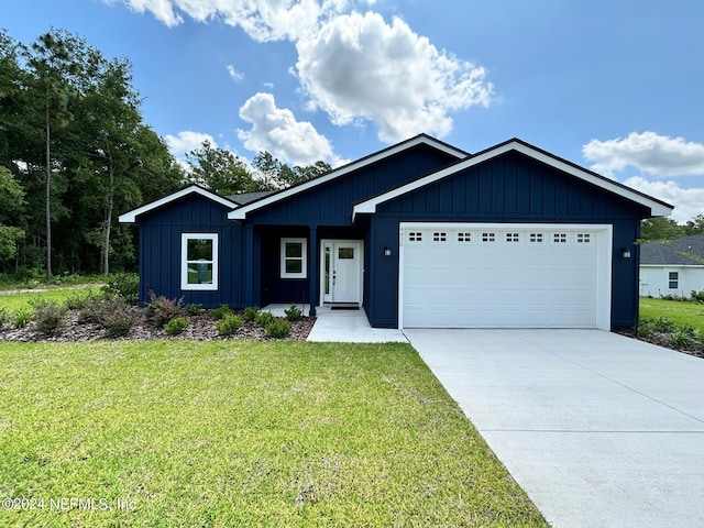 view of front facade featuring a front yard and a garage