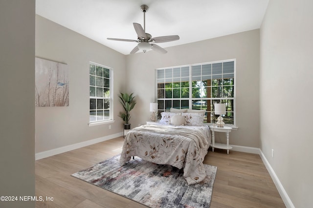 bedroom featuring ceiling fan and light hardwood / wood-style floors