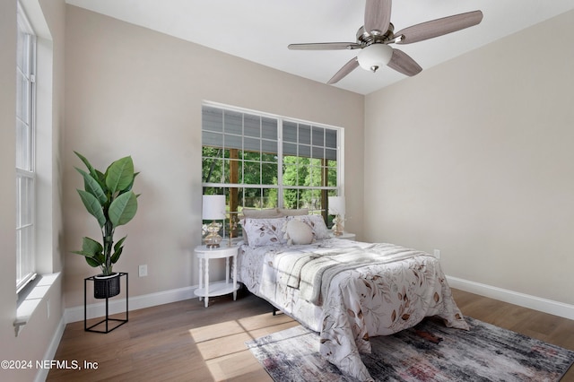 bedroom with hardwood / wood-style flooring and ceiling fan