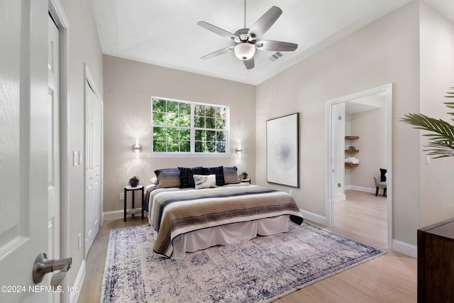 bedroom featuring light hardwood / wood-style floors and ceiling fan