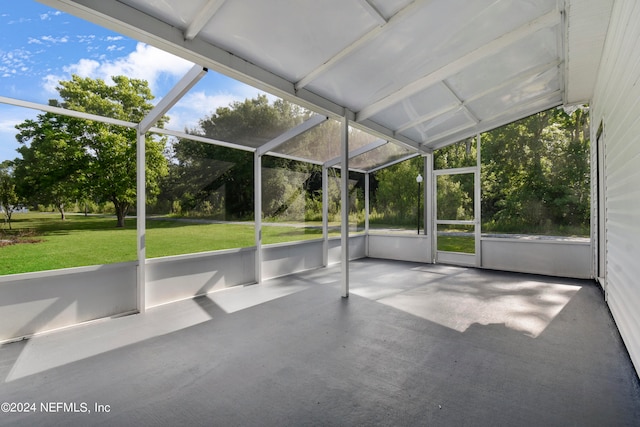 unfurnished sunroom with vaulted ceiling